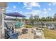 Spacious backyard with pool, patio, and water views offers a perfect outdoor retreat at 7626 Hatteras Dr, Hudson, FL 34667
