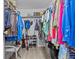 Walk-in closet providing ample storage with organized shelves and hanging rods at 7626 Hatteras Dr, Hudson, FL 34667
