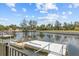 Dock on serene canal offering easy access to the water for boating and recreational activities at 7626 Hatteras Dr, Hudson, FL 34667