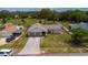 Aerial view of the home with a large lot and attached two-car garage at 8126 Wooden Dr, Spring Hill, FL 34606