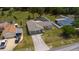 Aerial view of home with a well-kept lawn, and a two-car garage at 8126 Wooden Dr, Spring Hill, FL 34606