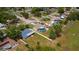 An aerial shot of a residential neighborhood showcasing homes with well-manicured lawns at 8126 Wooden Dr, Spring Hill, FL 34606