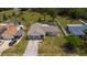 Aerial view of the property with a large, green lawn at 8126 Wooden Dr, Spring Hill, FL 34606