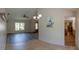 Sun-filled dining area showcases neutral walls and a modern chandelier for elegant meals at 8126 Wooden Dr, Spring Hill, FL 34606