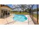 Sparkling screened-in pool with patio area for outdoor enjoyment at 8126 Wooden Dr, Spring Hill, FL 34606