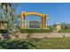 Elegant community sign for Water's Edge, set amidst beautifully landscaped grounds, welcomes residents at 9124 Topneck St, New Port Richey, FL 34654