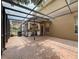 Exterior view of covered brick patio and outdoor kitchen area attached to the home at 9124 Topneck St, New Port Richey, FL 34654