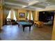 Enjoyable game room featuring a pool table, foosball, and lounge seating for residents' entertainment at 9124 Topneck St, New Port Richey, FL 34654