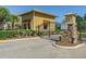 Guard house at the gate to the community with well maintained landscaping at 9124 Topneck St, New Port Richey, FL 34654