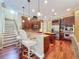 Kitchen featuring an island, stainless appliances, and seating at the counter at 9124 Topneck St, New Port Richey, FL 34654