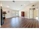This is a large living room with wood floors, a high ceiling, and plenty of natural light at 9124 Topneck St, New Port Richey, FL 34654