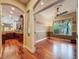 View of an office space with hardwood floors, neutral wall colors and natural lighting coming through the window at 9124 Topneck St, New Port Richey, FL 34654