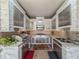Close-up of outdoor kitchen featuring granite counter and stainless appliances at 9124 Topneck St, New Port Richey, FL 34654