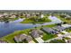 A beautiful aerial view of an upscale residential neighborhood showcasing multiple homes and a small lake at 9125 Palm Beach Dr, Brooksville, FL 34613