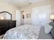 Cozy bedroom featuring neutral colored walls and carpet at 9125 Palm Beach Dr, Brooksville, FL 34613