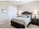 Bedroom featuring a sleigh bed, side tables with lamps, and a double door closet at 9125 Palm Beach Dr, Brooksville, FL 34613