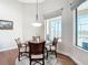 Cozy breakfast nook featuring pool views, a stylish light fixture, and comfortable seating at 9125 Palm Beach Dr, Brooksville, FL 34613
