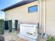 Efficient Generac backup generator installed on the side of the home, providing reliable power during outages at 9125 Palm Beach Dr, Brooksville, FL 34613