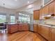 Modern kitchen featuring hardwood floors, granite countertops, and stainless steel appliances at 9125 Palm Beach Dr, Brooksville, FL 34613