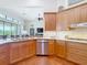 Spacious kitchen featuring stainless steel appliances, granite countertops, and stylish maple cabinetry at 9125 Palm Beach Dr, Brooksville, FL 34613