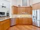 Beautiful kitchen featuring granite countertops, stainless steel appliances, and maple cabinets at 9125 Palm Beach Dr, Brooksville, FL 34613