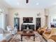 Comfortable living room with hardwood floors, plush seating, and a large decorative rug at 9125 Palm Beach Dr, Brooksville, FL 34613