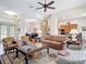 Inviting living room with hardwood floors, comfortable furniture, and an open floor plan at 9125 Palm Beach Dr, Brooksville, FL 34613