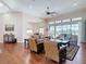 Expansive living area with hardwood floors and natural light, and access to the outdoor pool at 9125 Palm Beach Dr, Brooksville, FL 34613