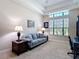 Bright home office with a comfortable couch, desk, and window with natural light at 9125 Palm Beach Dr, Brooksville, FL 34613
