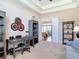 Inviting home office with built-in desk, bookshelves, and a comfortable sofa at 9125 Palm Beach Dr, Brooksville, FL 34613