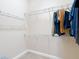 Spacious walk-in closet with carpet floors and wire shelving provides ample storage space at 9125 Palm Beach Dr, Brooksville, FL 34613