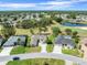 Aerial view of homes backing onto the golf course and a pond at 9216 Tarleton Cir, Weeki Wachee, FL 34613