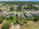 Aerial view of houses situated alongside a golf course at 9216 Tarleton Cir, Weeki Wachee, FL 34613