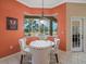 Bright dining area with view of the back yard and pool at 9216 Tarleton Cir, Weeki Wachee, FL 34613