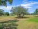 Lush golf course with mature trees and manicured greens at 9216 Tarleton Cir, Weeki Wachee, FL 34613