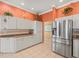 Bright kitchen with stainless steel appliances, granite countertops, and white cabinets at 9216 Tarleton Cir, Weeki Wachee, FL 34613
