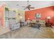 Comfortable living room with carpet, ceiling fan, and plenty of natural light at 9216 Tarleton Cir, Weeki Wachee, FL 34613