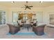 Open patio area with cozy seating, an outdoor kitchen, and direct access to the living room at 9216 Tarleton Cir, Weeki Wachee, FL 34613