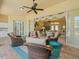 Open patio area with comfortable seating and an outdoor kitchen, leading to the living room at 9216 Tarleton Cir, Weeki Wachee, FL 34613