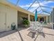 Outdoor patio with a grill, dining table, and view of the backyard and spa at 9216 Tarleton Cir, Weeki Wachee, FL 34613