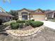 Charming single-story home with a well-manicured lawn, decorative rock border and inviting curb appeal at 9311 Haas Dr, Hudson, FL 34669