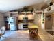 Lovely kitchen features stainless steel appliances, granite countertops and an island with storage at 9311 Haas Dr, Hudson, FL 34669