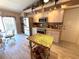Bright kitchen with stainless steel appliances, granite countertops, and an island with fruit basket at 9311 Haas Dr, Hudson, FL 34669
