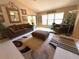 Living room with vaulted ceilings, multiple sitting areas, and a decorative rug at 9311 Haas Dr, Hudson, FL 34669