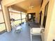 Comfortable screened patio perfect for entertaining, with ceiling fan and outdoor furniture at 9311 Haas Dr, Hudson, FL 34669