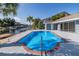 Backyard with pool, patio area and view of a canal and waterway at 9930 San Diego Way, Port Richey, FL 34668