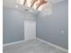 Empty room with vaulted ceiling, skylight, tile floor, and neutral walls at 9930 San Diego Way, Port Richey, FL 34668