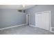 Neutral bedroom features modern ceiling fan, light walls, and access to other rooms at 9930 San Diego Way, Port Richey, FL 34668