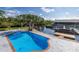 Backyard pool by a waterfront canal at 9930 San Diego Way, Port Richey, FL 34668
