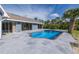 Backyard with a swimming pool at 9930 San Diego Way, Port Richey, FL 34668